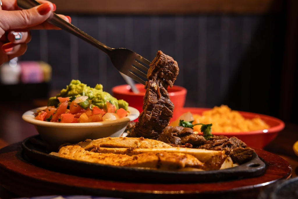 Mi Rancho beef and chicken fajitas with guacamole and rice